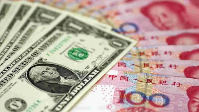 经济观察：人民币对美元中间价重返7.1区间